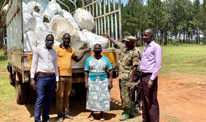 The District vice chairperson (blue dress) , Deputy RDC(left) with the principle Agric officer  receiving cuttings from supplier.