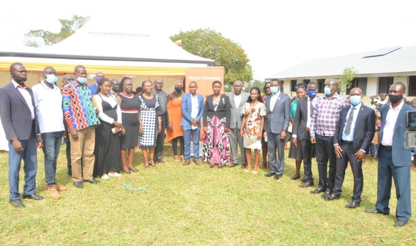 state minister for education Rosemary Ssenindde poses for a group photo during the launch of digital learning in Isenda primary school -Kigandalo sub county.