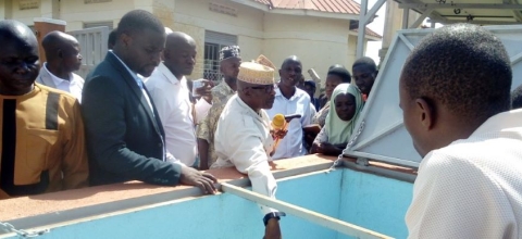 Mayuge RDC, Lt. Hajji Walugembe Aramandhani, officially commissions the solar-powered water supply system in Mitimito village (November 2025).